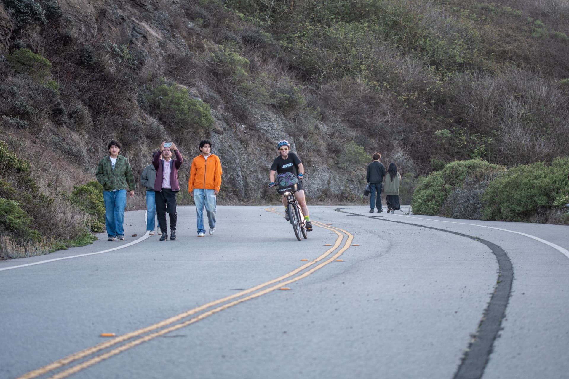 Riding past a group of startled pedestrians on the Twin Peaks climb
